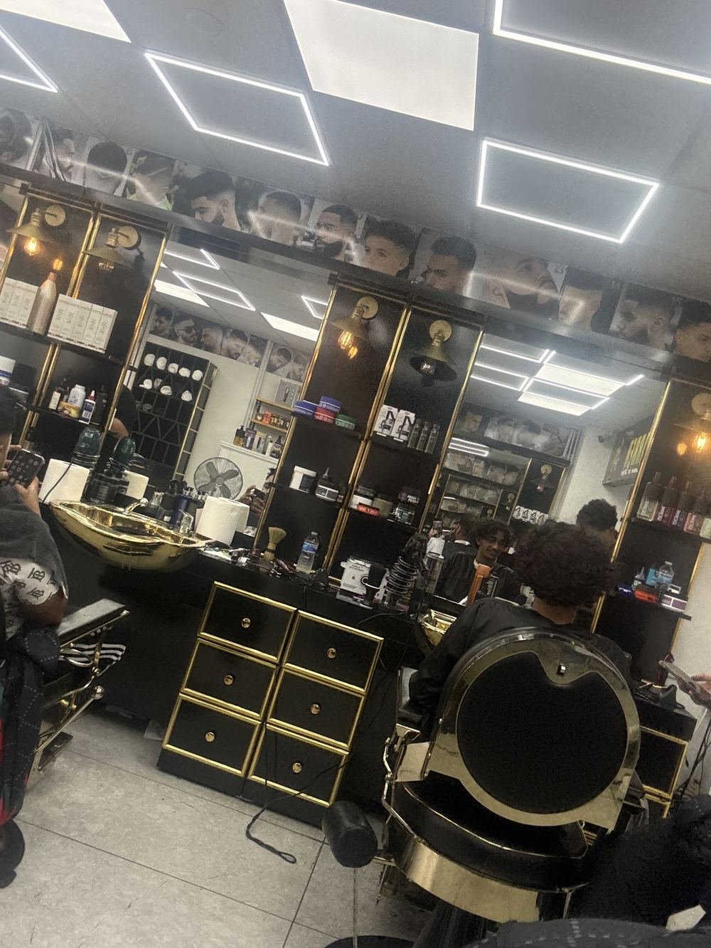 Black and gold drawers and a barber chair